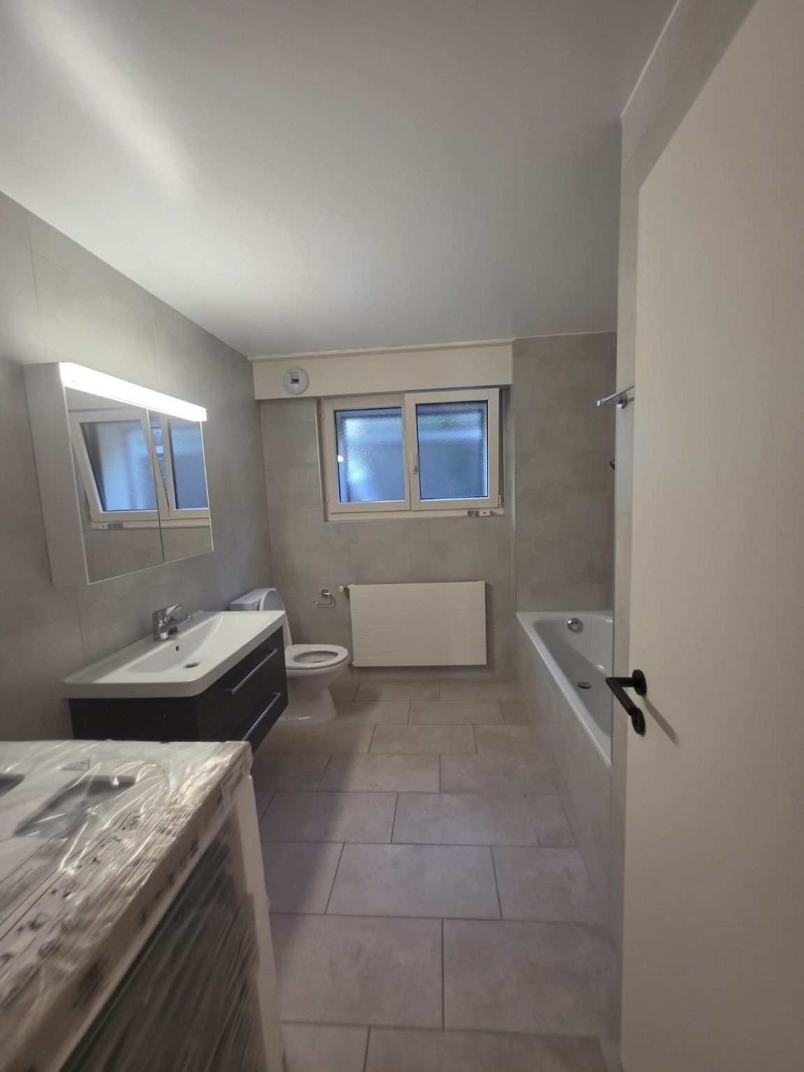 Salle de bains remise à neuf dans l’appartement rénové à Vevey